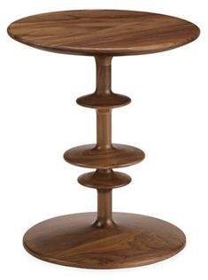 a round wooden table with three tiered shelves on the bottom and one shelf below it