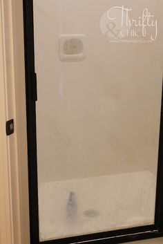 a white toilet sitting next to a window in a bathroom on top of a tiled floor