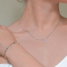 This elegant heart pendant necklace is crafted from high-quality stainless steel and features a cubic zirconia insert. Hypoallergenic and waterproof, it’s perfect for daily wear without tarnishing, offering durability and style. Pendant Size: 10 mm x 10 mm (0.39 x 0.39 inches) Necklace Length: 450 mm + 50 mm extender (17.72 + 1.97 inches) Hypoallergenic Heart-shaped Stainless Steel Jewelry, Silver Stainless Steel Heart Necklace, Elegant Silver Heart Necklace In Stainless Steel, Minimalist Stainless Steel Heart Charm Jewelry, Elegant Silver Stainless Steel Heart Necklace, Silver Heart Cut Stainless Steel Jewelry, Hypoallergenic Heart Shaped Stainless Steel Necklace, Minimalist Stainless Steel Heart Pendant Jewelry, Silver Stainless Steel Open Heart Jewelry