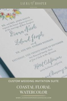 the wedding stationery is displayed with flowers