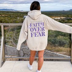 Embrace your faith over fear with this trendy Christian hoodie for women, featuring a stylish oversized sweatshirt design with a Bible verse aesthetic. Elevate your streetwear game with this Y2K preppy hoodie that combines fashion-forward style with a powerful message of faith. ABOUT THE HOODIE Gildan 18500 50% cotton, 50% polyester Medium-heavy fabric  Classic fit Tear-away label Runs true to size Size UP 1-2 Sizes for oversized fit PROCESSING AND SHIPPING  In effort to be eco friendly all shir Inspirational Hoodie For Fall Streetwear, Inspirational Fall Streetwear Hoodie, Inspirational Long Sleeve Hoodie For Fall, Bible Verse Aesthetic, Verse Aesthetic, Preppy Hoodie, Hoodie For Women, Y2k Preppy, Y2k Hoodie