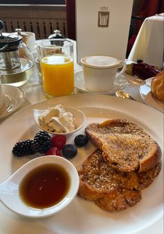 toast, fruit and coffee on a white plate