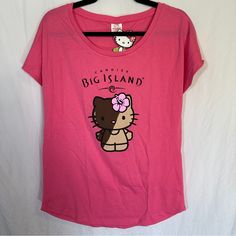 a hello kitty t - shirt hanging on a hanger