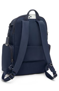 This travel-ready backpack features a handy Add-A-Bag sleeve for sliding onto suitcases along with a durable nylon design and well-organized interior. Top carry handle; adjustable backpack straps Two-way top-zip closure Exterior front zip pockets; side zip pocket; back smartphone pocket; back luggage sleeve Interior zip pockets; padded laptop pocket Nylon/leather Imported This bag includes Tumi Tracer®, an exclusive, complimentary program that helps reunite lost or stolen bags with their rightfu Modern Nylon Luggage For On-the-go, Nylon Laptop Backpack With Luggage Sleeve, Versatile Travel Backpack With Anti-theft Pocket, Versatile Backpack Luggage With Anti-theft Pocket, Versatile Anti-theft Backpack Luggage, Travel Laptop Bag With Anti-theft Pocket, Travel Laptop Backpack With Anti-theft Pocket, Nylon Laptop Bag With Luggage Sleeve For Travel, Versatile Laptop Backpack For Trip