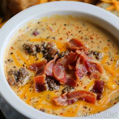 a white bowl filled with cheese and bacon soup