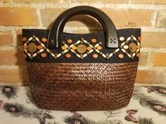 "++ SUN N SAND WOVEN PURSE ++ Beautiful tightly woven purse Wooden beads Wooden arched handle straps It opens up by a magnetic snap clasp to one fully lined main compartment with an extra slip and zipper pocket In wonderful vintage condition ✂ - - - Measurements: height: 9.5\" width: 16\" bottom: 4.5\" strap drop: 2\" Let's be friends! https://www.facebook.com/TheGirlSaidYesVintage 1" Summer Beaded Rectangular Beach Bag, Bohemian Beaded Bags For Vacation, Summer Vacation Beaded Beach Bag, Summer Vacation Beaded Straw Bag, Bohemian Beaded Beach Bag For Summer, Summer Beach Beaded Straw Bag, Beaded Straw Bag For Everyday Summer Use, Beaded Natural Straw Bag For Beach, Beaded Straw Beach Bag