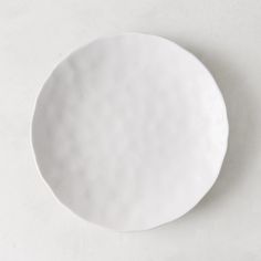 a white plate sitting on top of a table