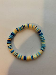 A beach bracelet based on flounder made with stretchy string Beach Bracelet, Beach Bracelets, Clay Bead, Bead Pattern, Pattern Ideas, Clay Beads, Beading Patterns, Jewelry Ideas, Jewelry Bracelets