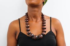 African wooden necklace, Statement Necklace, Wooden Bead Jewelry, Beaded women jewelry, Tribal necklace, Christmas gift for her, Mom's gift An elegant necklace that can compliments any outfit. Handmade by the Maasai women in Kenya using wooden beads. One size fits all. Color: Brown Necklace length: 20 inches 3-5 days delivery via DHL Express.  Pay shipping fee for the first item only and additional items ship for FREE. To view more wooden necklaces in our shop, kindly click here:  https://www.etsy.com/shop/NkoroiCrafts?ref=shop-header-name&listing_id=1295099274&section_id=43662872 Gift Wooden Beaded Necklaces, Gift Wooden Beads Necklace, Gift Beaded Necklaces With Wooden Beads, Mahogany Wooden Beads Jewelry, Mahogany Colored Wooden Bead Jewelry, Wooden Large Beads Jewelry As Gift, Wooden Round Beads Necklace As Gift, Wooden Brown Beaded Necklace Gift, Wooden Round Bead Necklaces As Gift