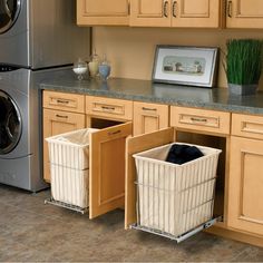 a kitchen with wooden cabinets and white baskets