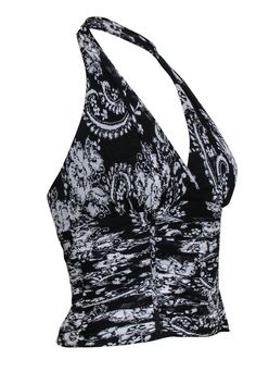 Bring those bold bohemian vibes into the summer months with this cropped creation from Carmen Marc Valvo! Made with a trendy halter neckline and adorned with a funky paisley and floral print on oh-so-soft silk, this ruched beauty is sure to turn heads at your next big music festival! Go free spirit fab (and sultry!) when you pair this must-have top with distressed denim shorts and strappy sandals. Size 6 100% Silk Concealed side zipper Lined Halter neckline Sleeveless All-over paisley and floral Bohemian Stretch Halter Top For Party, Elegant Fitted Halter Top For Vacation, Fitted Bohemian Halter Top For Party, Fitted Bohemian Halter Top, Bohemian Halter Top For Spring Party, Black Bohemian Halter Top For Party, Elegant Halter Neck Top For Festivals, Chic Fitted Halter Top For Festivals, Bohemian Halter Neck Tops For Party