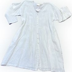 Coastal Casual 100% Linen Empire Style Dress. Fitted Bodice With Fullness Thru The Hip Area. Perfect For Summer Weather! 3/4” Sleeves,Button Front With Onseam Pockets. Soft White Color. Pit To Pit 24” Across Front Hip Measures 34” Shoulder To Hem 39” Tags On Never Worn. Classic Long Sleeve Summer Dresses, 3/4 Sleeve Beach Dress With Buttons, Beach Dresses With 3/4 Sleeves And Buttons, White Flowy Buttoned Dress, Beach Dresses With Buttons And 3/4 Sleeves, White Flowy Dress With Buttons, Flowy White Dresses With Buttons, Casual White Dress With 3/4 Sleeves, Classic Long Sleeve Linen Dress