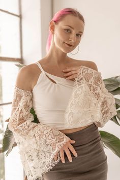 Take a plain top or dress to the next level with a unique lace sleeve shrug! The stretch in the back makes this a medium to a large. Stretch Crop Top With Sheer Sleeves For Spring, Stretch Lace Long Sleeve Crop Top, Bohemian Fitted Tops With Built-in Bra, Bohemian Tops With Built-in Bra, Bohemian Tops With Built-in Bra And Fitted Style, Chic Fitted Summer Shrug, Fitted Shrug With Lace Sleeves For Spring, Fitted Top With Sheer Sleeves For Brunch, Fitted Lace Top For Summer Layering