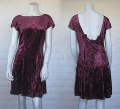 "Super cute 1990s velvet dress with low back - great for the holiday season! It's burgundy with a crushed velvet texture and a body-skimming cut. The dress ends right above the knee and the low cut back is trimmed with three velvet rosettes. Unlined and without closures. The label reads All That Jazz. Measurements: tagged vintage size medium; this is similar to a modern medium as well. It has some stretch; at rest it measures bust 38\", waist 30\", and hips 41\". It's 36\" from shoulder to hem. 90s Velvet Dress, Red Short Dress, Dress With Low Back, 90s Velvet, Burgundy Velvet Dress, Velvet Texture, Red Romper, Velvet Mini Dress, Red Dress Short