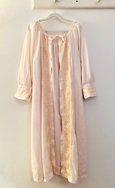 1960's Philmaid baby pink nightgown with cream, lace details. Listing includes sleeveless nightdress with matching long sleeve overcoat. 100% Nylon in size large. Spring Lace Trim Robe For Bedtime, Spring Bedtime Robe With Lace Trim, Beige Sleepwear For Wedding Night In Spring, Beige Spring Wedding Night Sleepwear, Spring Wedding Night Beige Sleepwear, Vintage Spring Robe With Lace Trim, Vintage Spring Robe For Home, Spring Vintage Robe With Lace Trim, Vintage Lace Trim Robe For Spring