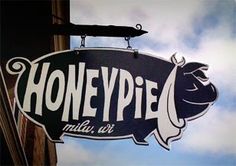 a sign hanging from the side of a building that says honeypie's italian restaurant