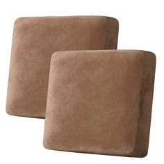 two brown pillows sitting next to each other