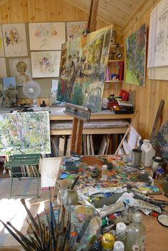 an artist's studio filled with lots of art supplies