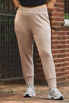 Crafted in DoubleSoft®, the Slim Cuff Pant 25" has been designed with a slightly shorter length for everyday wearability. Cut for a slim, tailored fit. | The Slim Cuff 25 Pants by Varley in Beige, Women's, Size: Largearge, Polyester/Viscose/Elastane at Anthropologie Fall Bottoms With Ribbed Cuffs And Tapered Leg, Relaxed Fit Bottoms With Ribbed Cuffs For Work, Fall Cargo Pants With Cuffed Ankles, Stretch Joggers For Workwear In Fall, Workwear Pants With Elastic Waistband And Cuffed Ankles, Solid Workwear Bottoms With Ribbed Cuffs, Solid Bottoms With Ribbed Cuffs For Workwear, Ankle-length Workwear Joggers, Fitted Bottoms With Cuffed Ankles For Fall