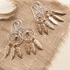 Who doesn't love the mystery and beauty of a dream catcher? Add a twinkle and a flash of colour to your Boho look with these beautiful dream catcher earrings! All of our jewellery comes gift boxed with a small card to write a gift message in! Dimensions: 14mm x 30mm and 18mm x 37mm Bohemian Rose Gold Dangle Jewelry, Bohemian Rose Gold Nickel-free Jewelry, Bohemian Rose Gold Jewelry With Ear Wire, Bohemian Rose Gold Earrings For Gift, Bohemian Rose Gold Nickel-free Earrings, Bohemian Style Rose Gold Jewelry For Festivals, Rose Gold Bohemian Jewelry For Festivals, Bohemian Rose Gold Earrings With Ear Wire, Bohemian Rose Gold Dangle Earrings