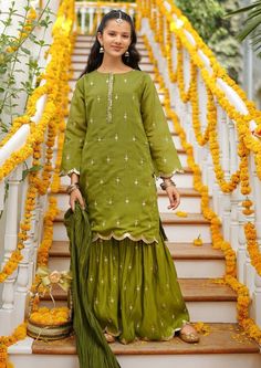 3- Piece Embroidered Suit for Girls Description : Top: Green Raw Silk Kurta with Hand Adda Work, Laces and TasselsBottom: Green Raw Silk Gharara.Dupatta: Green Dupatta Spring Sharara With Dori Work In Chanderi, Spring Chanderi Sharara With Dori Work, Traditional Pista Green Sharara For Spring, Traditional Spring Sharara With Dori Work, Traditional Green Sharara For Spring, Spring Unstitched Sets With Dori Work, Traditional Sets With Dori Work For Spring, Chanderi Sharara For Festivals, Green Traditional Wear With Dori Work For Spring