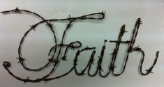 the word truth written in barbed wire