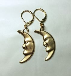 A fabulous pair of crescent moon earrings gold tone made in raw brass for pierced ears, a lovely man in the moon.  Great for the lover of the sky at night Raw brass is great, the look of 9ct gold without the price tag The charms are stamped metal and are single sided  See also other celestial earrings and other items from my range Measurement :   Moon 3cm long The charm is single sided Gold Moon-shaped Metal Hoop Earrings, Gold Moon Shaped Metal Hoop Earrings, Gold Half Moon Celestial Earrings, Gold Crescent Earrings With Moon Phase Detail, Gold Moon Shaped Hoop Earrings, Gold Celestial Plug Earrings, Gold Moon-shaped Earrings With Moon Charm, Gold Moon Phase Earrings, Gold Moon-shaped Pierced Earrings