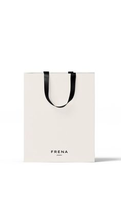 a white shopping bag with black handles and the word frena on it's side