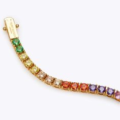 This gold Tennis Bracelet features multi-coloured gemstones for an exciting pop of colour. The inside is engraved with the 'Spread The Rainbow' slogan whilst the open box clasp is in gold for an infinity look.One Size: 7.5 inches.Materials: Brass 75%, CZ 20%, Enamel 5%.Arrives in a randomly selected coloured pouch.Style number: 8843869429 Gold Tennis Bracelet, Bracelet Rainbow, Arm Cuff, Box Clasp, Kurt Geiger, Tennis Bracelet, Open Box, Gemstone Colors, Anklets