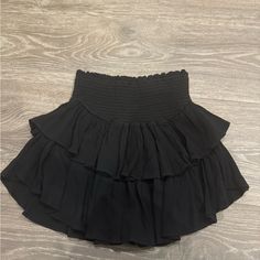 Size Medium Black Ruffle Skirt From Local Boutique-Never Worn Perfect Condition Super Cute Just Doesn't Fit Me Black Fluffy Skirt, Black Ruffled Mini Skirt Skort, Black Ruffled Mini Skort, Black Stretch Tiered Skort, Black Ruffled Skort, Black Ruffled Mini Skirt For Night Out, Black Tiered Mini Skirt Chic Style, High Waist Black Ruffled Mini Skirt, Chic Black Skort With Elastic Waistband