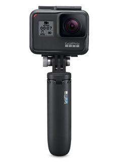 the gopro action camera is mounted on top of a tripod with an external lens