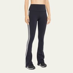 Splits59 "Raquel" supportive and opaque pants feature contrasting double-striped sides Designed in moisture-wicking, quick-drying, four-way stretch Supplex fabric High-rise waistband  Cropped at the ankle Fitted through hip; flared from knee Pull-on style  Nylon/spandex Imported Full Length Athleisure Pants With Three Stripes, Sporty High-waist Training Bottoms, Sporty High Waist Bottoms For Training, Athleisure Full-length Bottoms With Three Stripes, Athleisure Full Length Bottoms With Three Stripes, Stretch Athleisure Pants With Three Stripes, Stretch Sportswear Bottoms With Side Stripes, Functional Bottoms With Elastic Side Panels, Black Athleisure Bottoms With Contrast Stripes