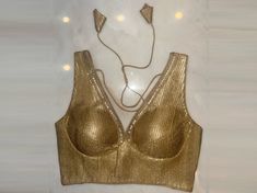 Buy golden shimmer saree blouse online in USA with sequin lace. Elevate your saree style with exquisite readymade sari blouses, embroidered saree blouses, Banarasi sari blouse, designer saree blouse, choli-cut blouses, corset blouses from Pure Elegance Indian fashion store in USA.-full view Gold V-neck Bollywood Blouse Piece, Gold V-neck Bollywood Choli, Fitted Gold Saree For Navratri, Gold Blouse For Party Season, Gold V-neck Choli For Festivals, Glamorous Gold Saree For Party, Gold Tops For Party And Festivals, Fitted Gold Saree For Festive Occasions, Gold V-neck Choli With Padded Blouse