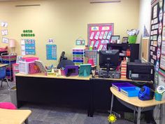 an empty classroom with desks, chairs and other items on the wall in front of it