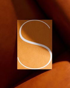 a close up of a paper with the letter s on it