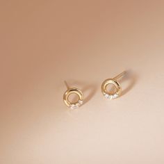 Want in on the minimalist earring trend, but upgraded with diamonds? We have just what you need with our Open Circle Diamond Studs - chic and simple and studded with six little diamonds. Product Details: Material: 14K Solid Yellow Gold Outer Diameter: 5.0mm Thickness: 1.2mm Total Carat Weight: 0.03carat Sold as a pair Minimalist Brilliant Cut Diamond Earrings, Minimalist Diamond Earrings For Anniversary, Minimalist White Gold Diamond Earrings, Minimalist Everyday Diamond Earrings With Accents, Everyday Minimalist Diamond Earrings With Accents, Minimalist Round Diamond Earrings For Everyday, Modern Everyday Diamond Earrings With Accents, Minimalist Diamond Accented Wedding Earrings, Minimalist Diamond Wedding Earrings With Accents