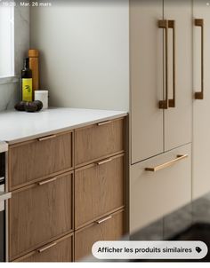 an image of a kitchen setting with white counter tops and wooden cabinets in the background