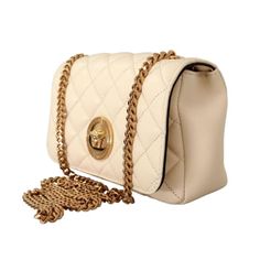 Stay in style with the Versace La Medusa Nappa Quilted Beige Leather Crossbodybag. This luxurious Versace shoulder bag features a polished gold chain link shoulder strap and a iconic gold Medusa head logo on the front. The quilted nappa leather shoulder bag opens to a roomy black fabric interior with a slip pocket. This bag is perfect for sunday brunch, date night, or any social gathering!    Model: DBFI163S  Beige quilted leather  Gold-tone hardware  Snap Closure  One interior slip pocket  Blac Cream Bags, Medusa Head, Small Crossbody Bag, Small Crossbody, Quilted Leather, Leather Chain, Nappa Leather, Leather Accessories, Satchel Bags