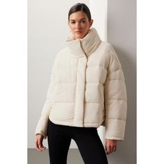 White nylon (100% Nylon). Lining (100% Nylon). Jacket. Long sleeves. High neck. Front zipper fly with button closure. 25" from shoulder to hemline. Imported. Beige Nylon Outerwear For Fall, Winter White Puffer Outerwear For Fall, Nylon Outerwear With Padded Collar For Fall, Fitted Beige Outerwear With Ribbed Cuffs, Beige Nylon Long Sleeve Puffer Jacket, Winter White Puffer Jacket With Padded Collar For Fall, Winter White Outerwear With Zipper For Cold Weather, Casual Winter White Nylon Outerwear, Beige Nylon Winter Outerwear