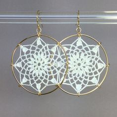 "Crochet doily earrings in white silk. Adapted from vintage motif \"No. 3\" from the 1940s. The diameter is approximately 1-5/8\", surrounded by 14K gold-filled hoops. They are lightweight and very comfortable. The jewelry has been treated with a water- and stain-repellent finish. Please be careful with your cosmetics and moisturizers, and you will have this lovely, lacy jewelry for years to come. Please remember, your screen may display colors differently from the actual item." Delicate Handmade White Hoop Earrings, White Bohemian Filigree Earrings, Delicate White Hoop Earrings With Ear Wire, White Round Filigree Earrings, Vintage White Filigree Earrings, Bohemian White Pierced Hoop Earrings, White Bohemian Pierced Hoop Earrings, Bohemian White Crochet Earrings, Crochet Earrings Pattern