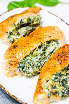 spinach stuffed chicken on a white plate