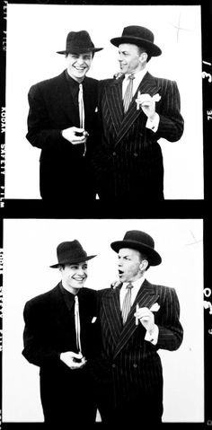 two men in suits and hats standing next to each other