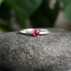 Sterling Silver Hot Pink Ruby Stacking Ring – AccentYourself Tiny Stackable Round Band Rings For Anniversary, Pink Bezel Set Stackable Rings For Anniversary, Fine Jewelry Red Birthstone Stackable Rings, Red Birthstone Stackable Rings Fine Jewelry, Ruby Stackable Birthstone Rings, Ruby Birthstone Stackable Rings, Ruby Stackable Round Band Promise Rings, Red Sterling Silver Birthstone Ring, Red Birthstone Ring In Sterling Silver