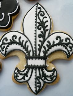 decorated cookies with black and white fleur de lis