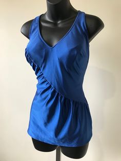 "Vintage 1970s 1980s Blue Swimsuit. Flattering ruched detail across torso. In-built bra, lined crotch. Measurements: Bust: 38\" Waist: 28\" - 30\" Hips: 36\" - 38\" Torso: 29\" Condition: Very good, vintage condition. Has not been cleaned Condition reflected in price." Fitted V-neck Lined Top, Stretch Sleeveless Lined Tops, Sleeveless Lined Party Top, Fitted Lined Party Tops, Fitted Lined Tops For Party, Retro Stuff, Blue Swimsuit, Floral Print Maxi Dress, Floral Print Maxi