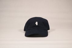 Brushed cotton navy unstructured cap with white Illinois embroidery. One size fits most 100% cotton Cotton hideaway strap Metal comfort buckle. Navy Adjustable Cotton Dad Hat, Navy Cotton Dad Hat With Embroidered Logo, Classic Navy Cotton Dad Hat, Navy Six-panel Cotton Dad Hat, Navy Cotton Six-panel Dad Hat, Navy Casual Adjustable Dad Hat, Navy Adjustable Casual Dad Hat, Navy Cotton 5-panel Baseball Cap, Navy Cotton Dad Hat