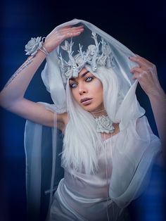 A gorgeous set (all items can be purchased together or separately) that consists of a snow-covered crown with white and silver colors branches with lots of rhinestones and fabric roses, a bracelet and a cape with white and pearl colors organza. Ideal for a maternity photo shoot or winter wedding. Will complement the image of the Snow Queen, Nymph, Forest Fairy and Elf. Accessory for the Met Gala or secret garden party. Ideal for an alternative wedding. The tiara is attached at the back with an e Fantasy White Wedding Headpieces, White Fantasy Wedding Headpieces, White Fairytale Fairy Dress For Parties, Whimsical White Fairy Dress For Wedding, White Fairycore Fairy Dress For Wedding, White Fairycore Dress For Wedding, White Fantasy Headpiece For Costume Party, White Fairycore Wedding Dress, Ice Fairy