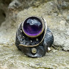 Oxidized silver ring with goldplating 24k. Round cabochone amethyst and yellow sapphires. Today it's a unique way to emphasize your individuality, create your own unique style All jeweleries are handmade and ONE of a Kind! Unique Cabochon Amethyst Ring, Unique Amethyst Cabochon Ring, Hand Forged Amethyst Ring As Gift, Handmade Turquoise Ring, Oxidized Silver Rings, Retail Displays, Modernist Jewelry, Amethyst Gem, Purple Band