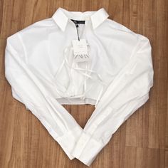 Zara Crop White Shirt Color: White Size: Large Condition: Brand New White Button-up Crop Top For Summer, White Collared Crop Top For Summer, White Long Sleeve Cropped Shirt For Day Out, Elegant White Cropped Shirt For Spring, Chic White Cropped Shirt For Summer, White Cropped Shirt For Fall, White Cropped Shirt For Summer, White Cropped Collared Shirt For Spring, White Cropped Shirt With Collar For Spring