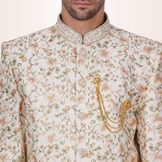 Introducing our versatile Fleur De Lis Sherwani for Men, a true masterpiece of style and sophistication. This sherwani boasts an intricate Fleur De Lis pattern that adds a touch of regal charm, making it the perfect complement to a variety of lehenga colors worn by your partner.Whether it's a wedding, engagement, or special celebration, this sherwani is your canvas for creating a harmonious and stunning ensemble. Paired elegantly with matching white pants, it exudes timeless elegance.Draped in t Lehenga Colors, Reception Outfits, Sherwani For Men, Mens Kurta Designs, Mens Kurta, Sari Blouse, Charm Making, Kurta Designs, White Pants